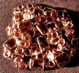 Made from dozens of PINK COLORED faceted crystals set in