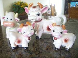 SALT & PEPPER SHAKERS COWS plus an extra cow shaker & cow creamer cup 