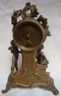   Works excellent nice Brass 2 angels with machine Clock  