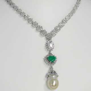   natural vibrant green Colombian emeralds and scintillating diamond s