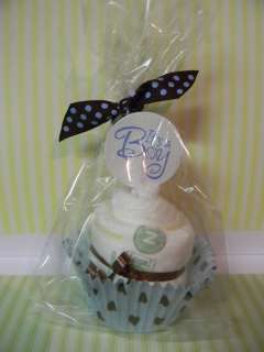 Youare bidding on a ITS A BOY diaper cupcake blue & brown, placed 