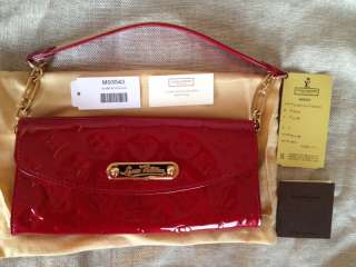 100% Authentic Louis Vuitton Sunset Boulevard clutch in P.Damore red 